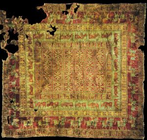 Pazyryk rug - a very old knotted carpet, much faded