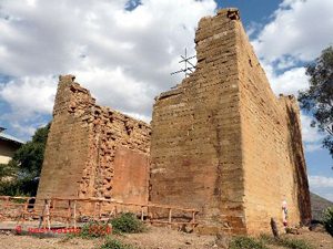 ruined red stone square building