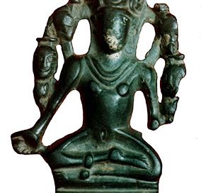 A small green stone statue of Vishnu