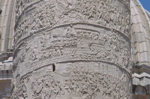 Scene from Trajan's Column: Roman soldiers crossing the Danube river in boats, using oars.