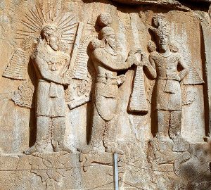 The Sassanid shah Shapur II hands power over to his general Ardashir II, while both of them trample on the defeated Julian.